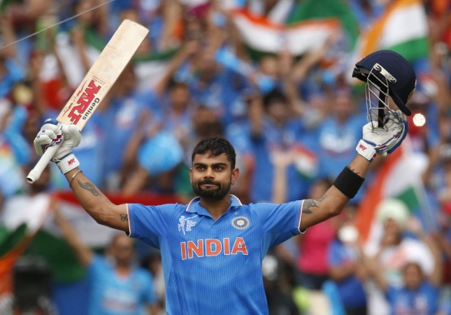 India's batsman Virat Kohli acknowledges the crowd upon scoring a century during their Cricket World Cup match against Pakistan in Adelaide Virat Kohli