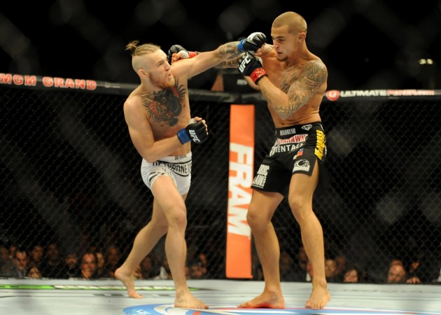 Conor McGregor (black and blue gloves) has very strong fists, which he uses to win his MMA fights Conor McGregor