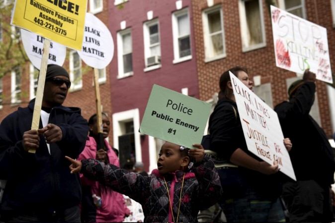 Demonstrators gather in front of Baltimore Police Department Western District in Baltimore, Maryland, April 25, 2015