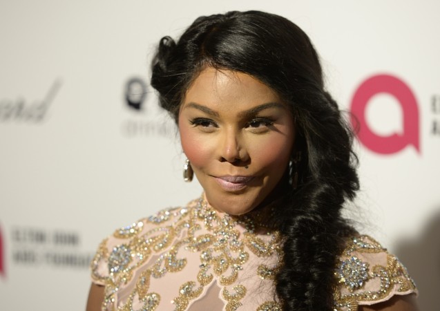 Rapper Lil' Kim arrives at the 2015 Elton John AIDS Foundation Oscar Party in West Hollywood, California February 22, 2015. lil' kim