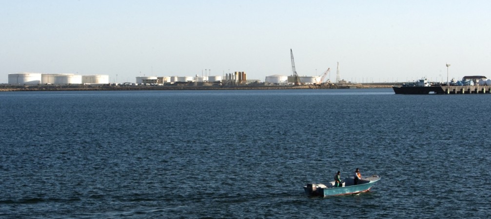 A speedboat passes by oil docks at the port of Kalantari in the city of Chabahar, 300km (186 miles) east of the Strait of Hormuz January 17, 2012. India iran Chabahar port