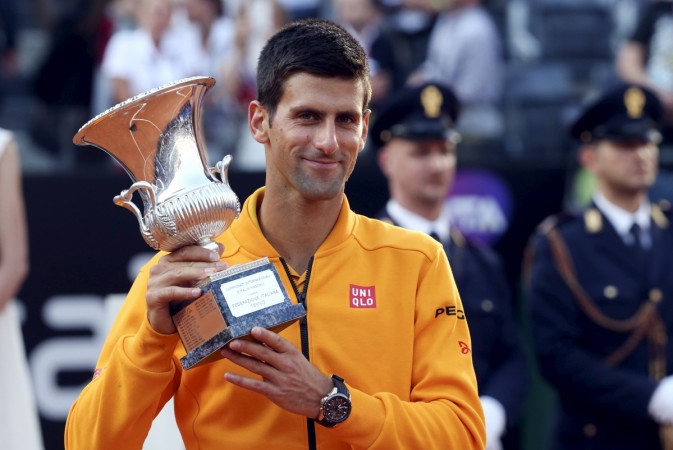 Novak Djokovic with the 2015 Rome Masters title after defeating Roger Federer in the finals. Novak Djokovic