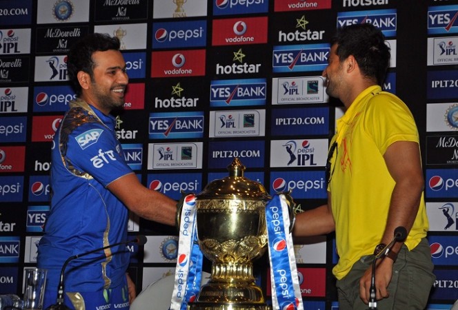 File photo: Mumbai Indians' Rohit Sharma and Chennai Super Kings' Suresh Rain pose with IPL trophy in 2015. Rohit Sharma Mumbai Indians Suresh Raina CSK