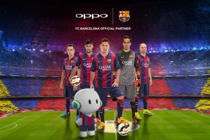 The Players of the First Team of FC Barcelona pose with the Oppo Mobile Mascot. The Players of the First Team of FC Barcelona pose with the Oppo Mobile Mascot