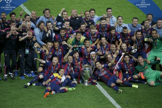 Barcelona players with the Champions League trophy Barcelona Champions League Title Trophy
