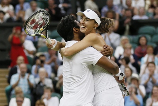 Leander Paes and Martina Hingis celebrate after winning the Wimbledon 2015 mixed doubles title Leander Paes Martina Hingis Wimbledon 2015