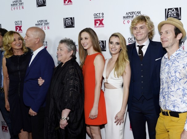Emma Roberts and Evan Peters with the cast of