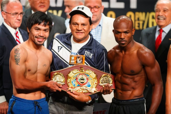 Manny Pacquiao (left) faces off against Timothy Bradley Jr during weigh ins prior to their boxing match at MGM Grand Garden Arena pacquiao bradley