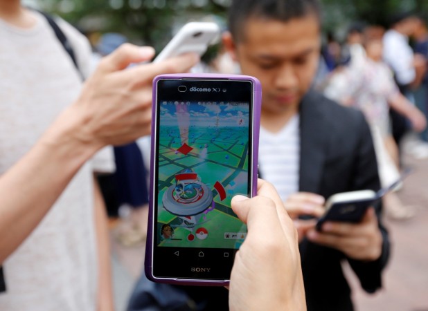 Men play the augmented reality mobile game