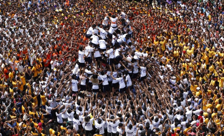 Krishna Janmashtami 2016: Top Bollywood songs to be played during the festival. Pictured: Devotees try to form a human pyramid to break a clay pot containing curd during the celebrations to mark the Hindu festival of Janmashtami.