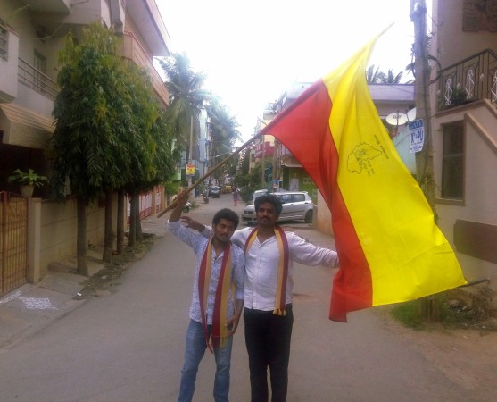 Youngsters with the Karnataka flag. Karnataka bandh