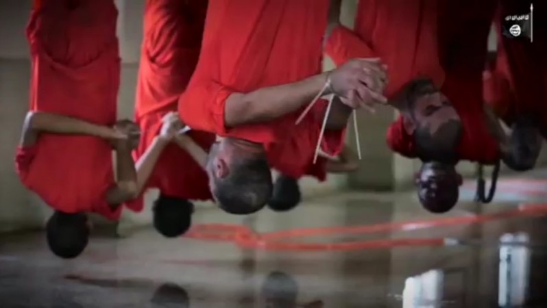 Shocking video shows Isis hanging prisoners from meat 