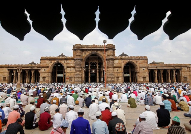 People wait to offer Eid al-Adha prayers outside a mosque in Ahmedabad, India September 13, 2016. Eid Al-Adha