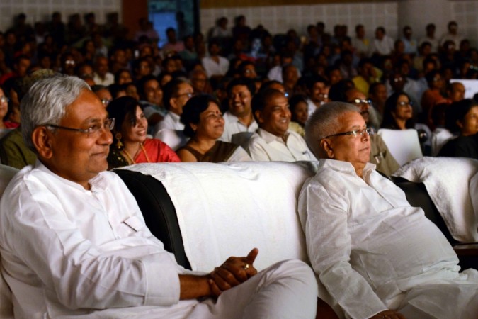 Bihar Chief Minister Nitish Kumar and RJD chief Lalu Prasad Yadav watch comedy drama. nitish kumar lalu prasad yadav