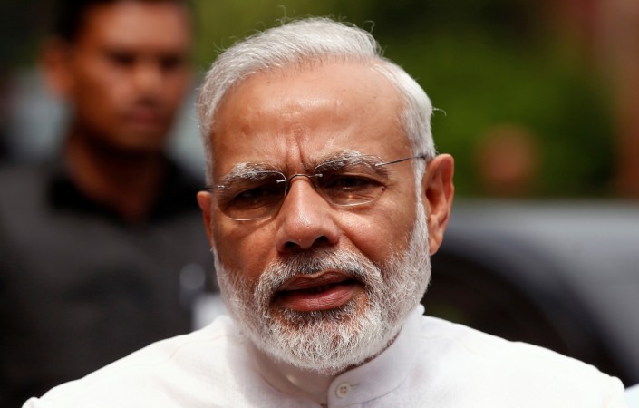 Prime Minister Narendra Modi speaks to the media inside the parliament premises