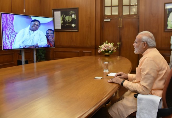 Prime Minister Narendra Modi interacts with Mata Amritanandamayi