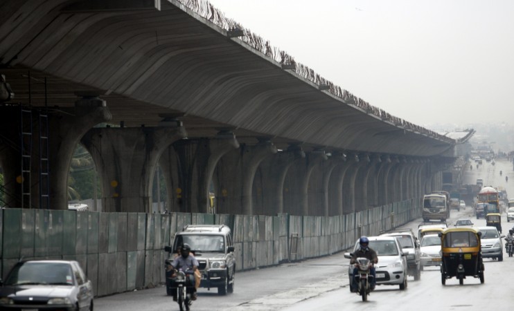 Vehicles ply past the new elevated highway under construction in Bangalore Steel Flyover project in Bangalore: Vociferous online campaign highlighting consequences goes viral; what is your take?