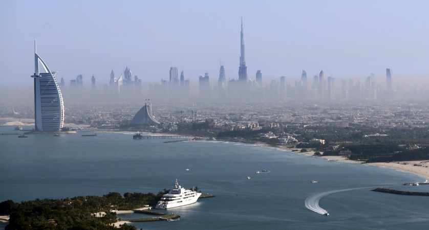 Burj Khalifa, the world's tallest tower, and luxury Burj al-Arab Hotel (L) are seen in a general view of Dubai, UAE December 9, 2015. Burj Khalifa