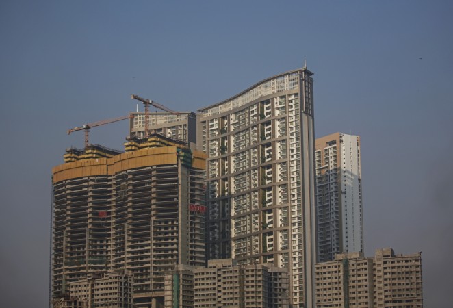 High rise under residential buildings which are under construction are seen around a residential tower in central Mumbai January 16, 2015 (representational image). pnb housing finance ipo public issue offer subsidiary pnb stake loans home india finance pay commission