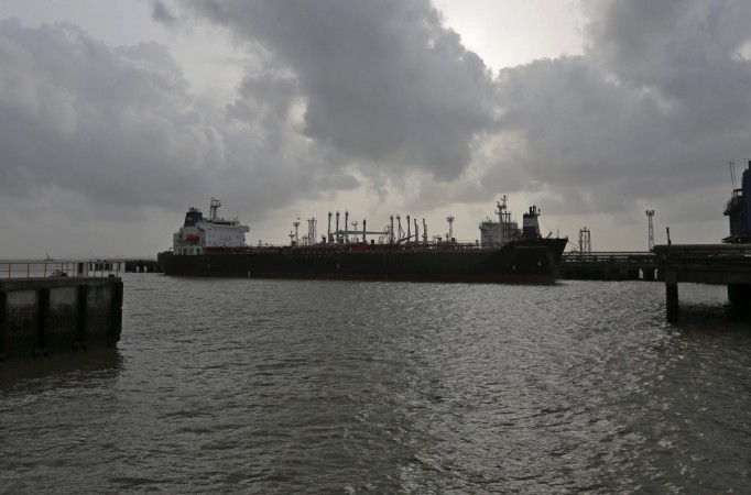 A cargo vessel awaits entry into the container terminal of Jawaharlal Nehru Port Trust (JNPT) in Mumbai, India, July 15, 2015. india trade data exports imports gold engg fieo trade deficit fastest growing economy gdp good analysts stock markets gold silver gems