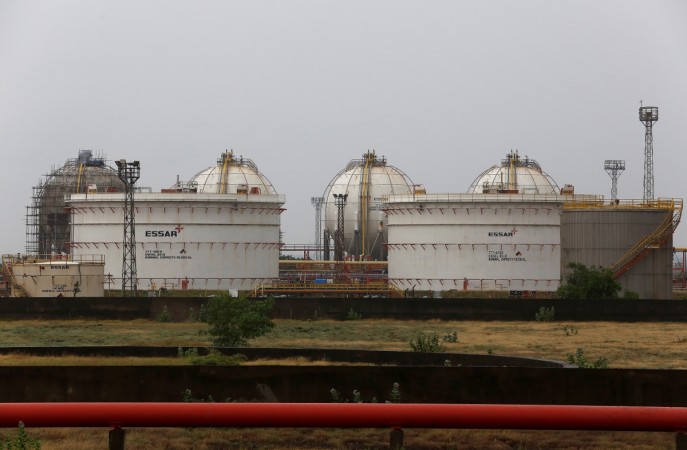 Storage tanks of an oil refinery of Essar Oil, which runs India's second biggest private sector refinery, are pictured in Vadinar in the western state of Gujarat, India, October 4, 2016 essar oil rosneft deal $12.9 billion brics summit 2016 russia oil and gas ruia prashant debt
