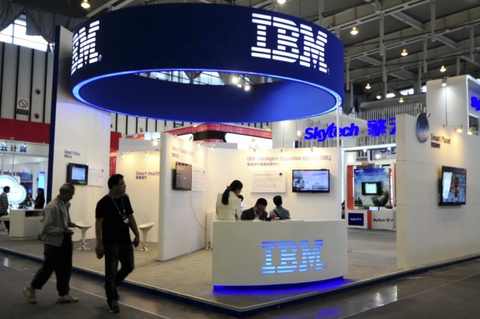 Visitors walk past the IBM booth at the 9th China International Software Product & Information Service Expo in Nanjing, Jiangsu province September 6, 2013. IBM