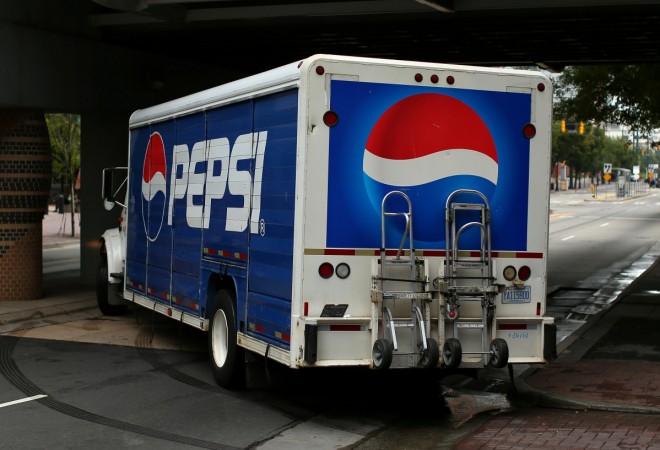 A Pepsi truck is shown in Charlotte, North Carolina, U.S., September 26, 2016. pepsico indra nooyi revenues sales income 2015 2014 operating profit us india sugar beverages soft drinks snacks