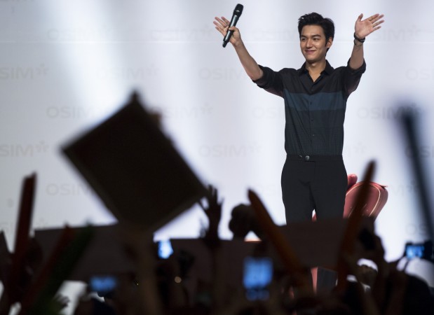 South Korean actor Lee Min-ho waves to fans during a promotional event in Hong Kong June 29, 2014. Lee Min Ho