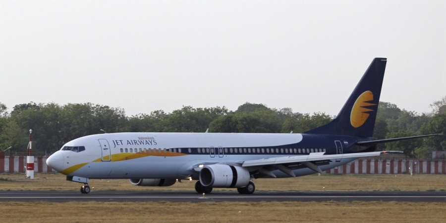 A Jet Airways passenger plane moves on the runway at the Sardar Vallabhbhai Patel international airport in the western Indian city of Ahmedabad April 24, 2013. etihad airways, jet etihad deal, etihad stake in jet airways, naresh goyal, jet airways share price, global aviation outlook