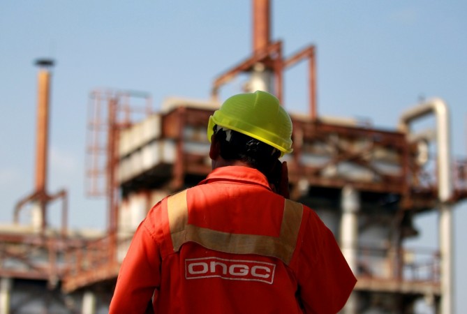 A technician is pictured inside a desalter plant of Oil and Natural Gas Corp (ONGC) on the outskirts of Ahmedabad, India, September 30, 2016. ongc share price results bonus hpcl bpcl ioc energy oil marketing psus production exploration dividend interim performance financial q2 sensex bse nse nifty
