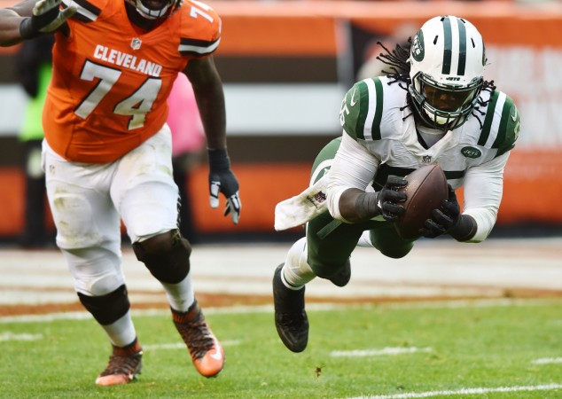 New York Jets outside linebacker Lorenzo Mauldin (55) makes a diving interception during the second half against the Cleveland Browns at FirstEnergy Stadium. The Jets won 31-28. New York Jets v Cleveland Browns