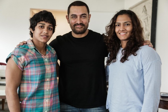 Pictured: Babita Kumari, Aamir Khan and Geeta Phogat (from left to right) Babita Kumari, Aamir Khan and Geeta Phogat