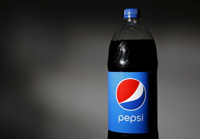 A bottle of Pepsi is seen in this file photo illustration varun beverages pepsi pepsico bottler jaipuria ravi kant public issue ipo subscription retail portion listing price band nse bse listing stock exchanges price band india rupees Rs