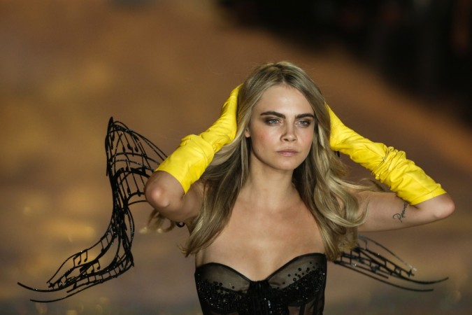 Pictured: Model Cara Delevingne presents a creation during the annual Victoria's Secret Fashion Show in New York, November 13, 2013. Cara Delevingne