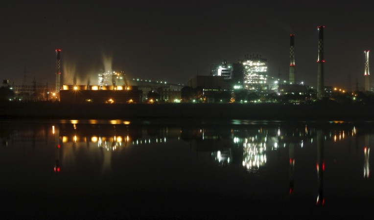 Smoke billows out from the cooling towers (L) of a coal-fired power plant in Ahmedabad, India, November 20, 2015 (representational image). thermax share price q2 results power plants boilers generators solar equipment water solutions industrial heaters coolers coal fired india gdp economy