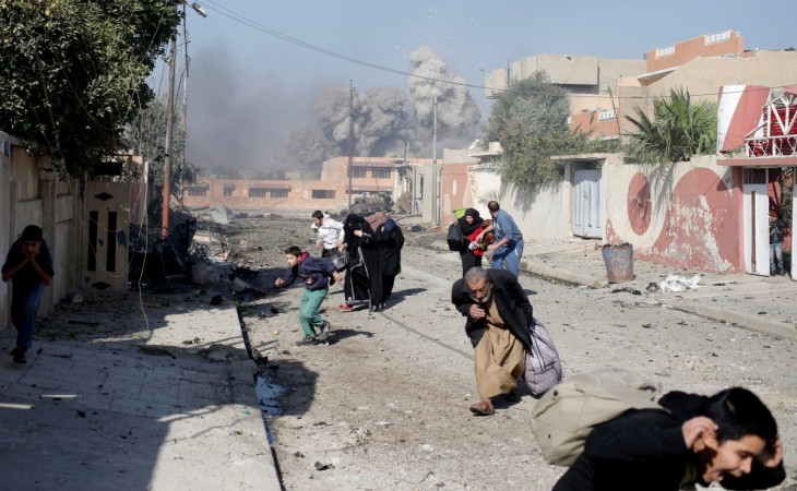 People run in panic after a coalition airstrike hit Islamic State fighters positions in Tahrir neighbourhood of Mosul, Iraq Battle for Mosul