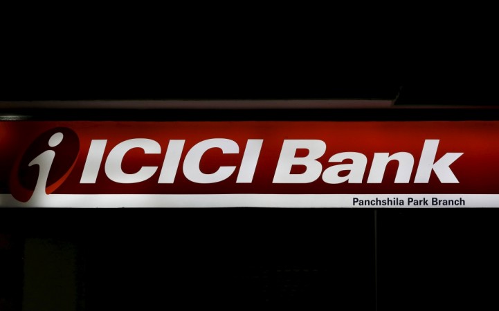 A signboard of the ICICI bank is pictured outside a bank in New Delhi demonetisation icici bank mdr debit cards credit cards digital india banks cash crunch modi govt hdfc bank india rupay npci trupay sbi canara bank