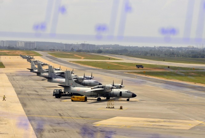 Parked Indian Air Force's transport aircrafts Antonov An-32 (foreground) and Dornier Do 228 are seen from the air traffic control during a media tour at the Yelahanka Air Force Station. Dornier Aircraft