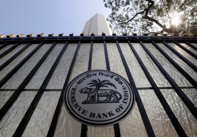 The Reserve Bank of India (RBI) seal is pictured on a gate outside the RBI headquarters in Mumbai, India, February 2, 2016. rbi rule deposit of rs 5000 more than demonetisation modi govt currency ban