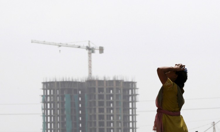 demonetisation construction real estate developer companies outlook fitch ratings sobha prestige puravankara dlf godrej india sensex grade