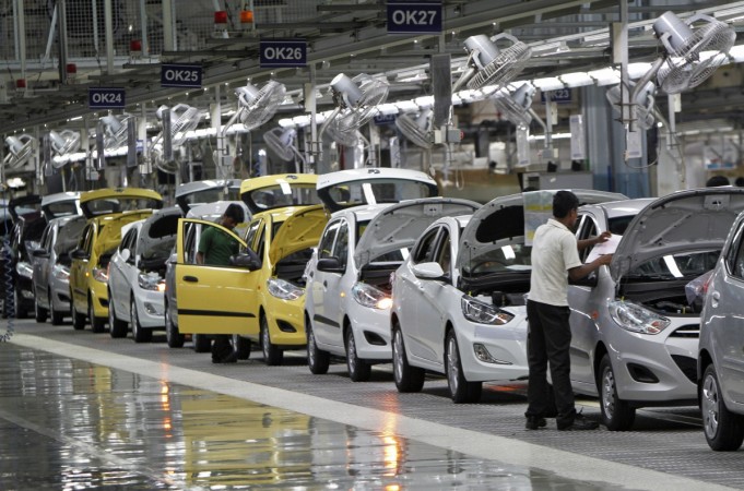 Workers assemble cars inside the Hyundai Motor India Ltd. plant at Kancheepuram district of Tamil Nadu October 4, 2012. Tamil Nadu J Jayalalithaa Assembly polls elections health apollo hospital cardiac arrest industry growth gsdp factories ford hyundai renault ashok leyland