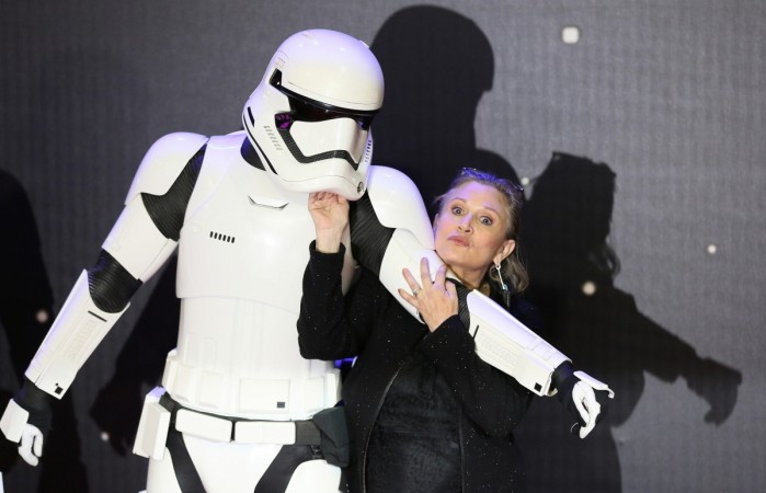 Carrie Fisher poses for cameras as she arrives at the European Premiere of Star Wars, The Force Awakens in Leicester Square, London, December 16, 2015. Carrie Fisher suffers heart attack