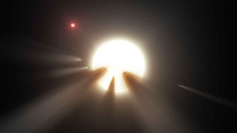 This artist's illustration shows comet fragments crossing the face of a star, one possible explanation for the strange dimming exhibited by Boyajian's star or Tabby star. Tabby's star