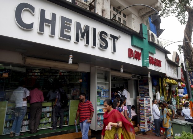 People walk past a chemist shop at a market in Mumbai, India, June 25, 2015 (representational image). india, pharma companies, sun, divi, cipla, cadilla, us fda, warning to indian companies, share price