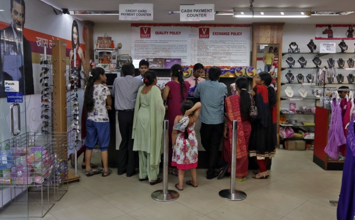 The drive to encourage people to embrace digital economy throws up interesting statistics, according to a brokerage house. Customers stand at the payment counters inside a V-Mart retail store in New Delhi April 6, 2013 (representational image). digital india, cashless economy, pm modi, demonetisation, bank transactions, online banking, mobile banking