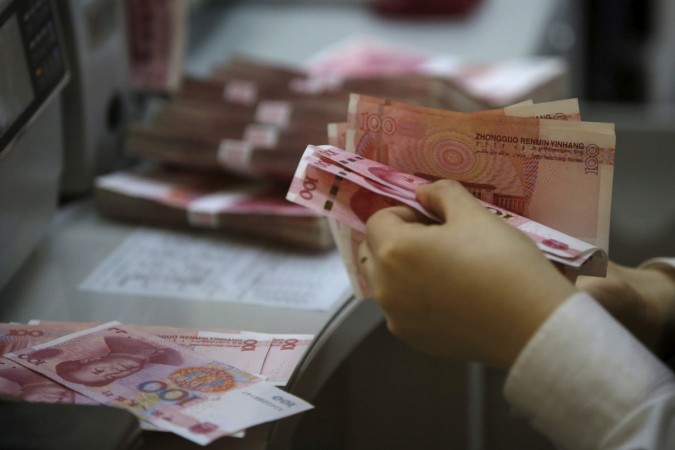 A clerk of ICBC bank counts Chinese one hundred Yuan at its branch in Beijing, China, April 13, 2016. yuan, rupee, yuan vs us dollar, rupee vs dollar, china, india, modi, jinping