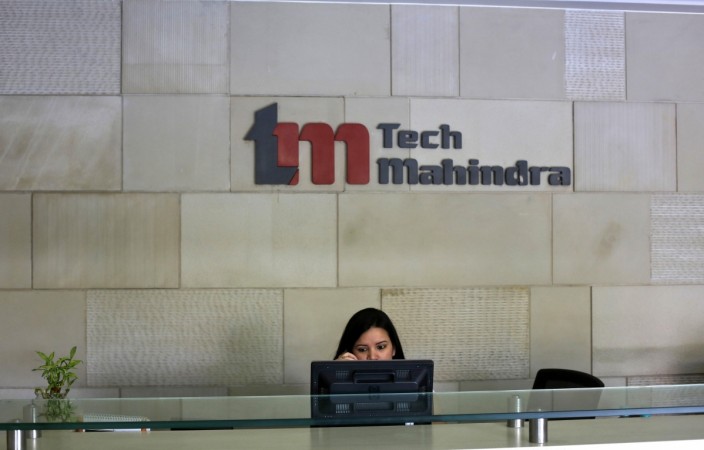 An employee sits at the front desk inside Tech Mahindra office building in Noida on the outskirts of New Delhi March 18, 2013 (representational image). q3fy2017 preview, q3 it results, infosys q3, tech mahindra q3, wipro q3, tcs q3, bse sensex