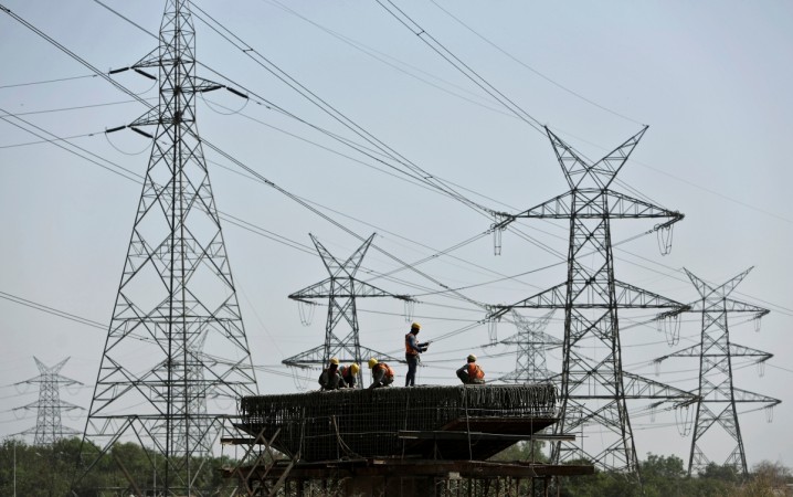 Workers fasten iron rods together on a metro pillar under construction in New Delhi, India (representational image). india news, india consumer inflation, india factory output, demonetisation, cash crunch, pm modi