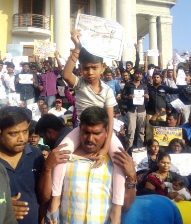 In picture: A young boy with his father participates in the protests against Jallikattu ban in Bengaluru on Thursday, January 19, 2017. Jallikattu protests in Bengaluru
