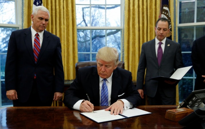 President Donald Trump signs executive order withdrawing US from TPP trade deal